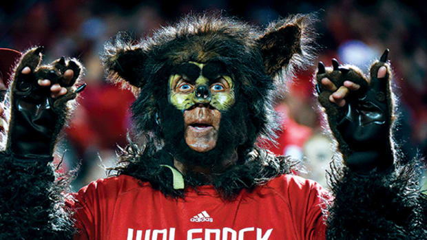 An NC State fan dresses as a wolf.